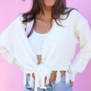 Distressed tie sweater